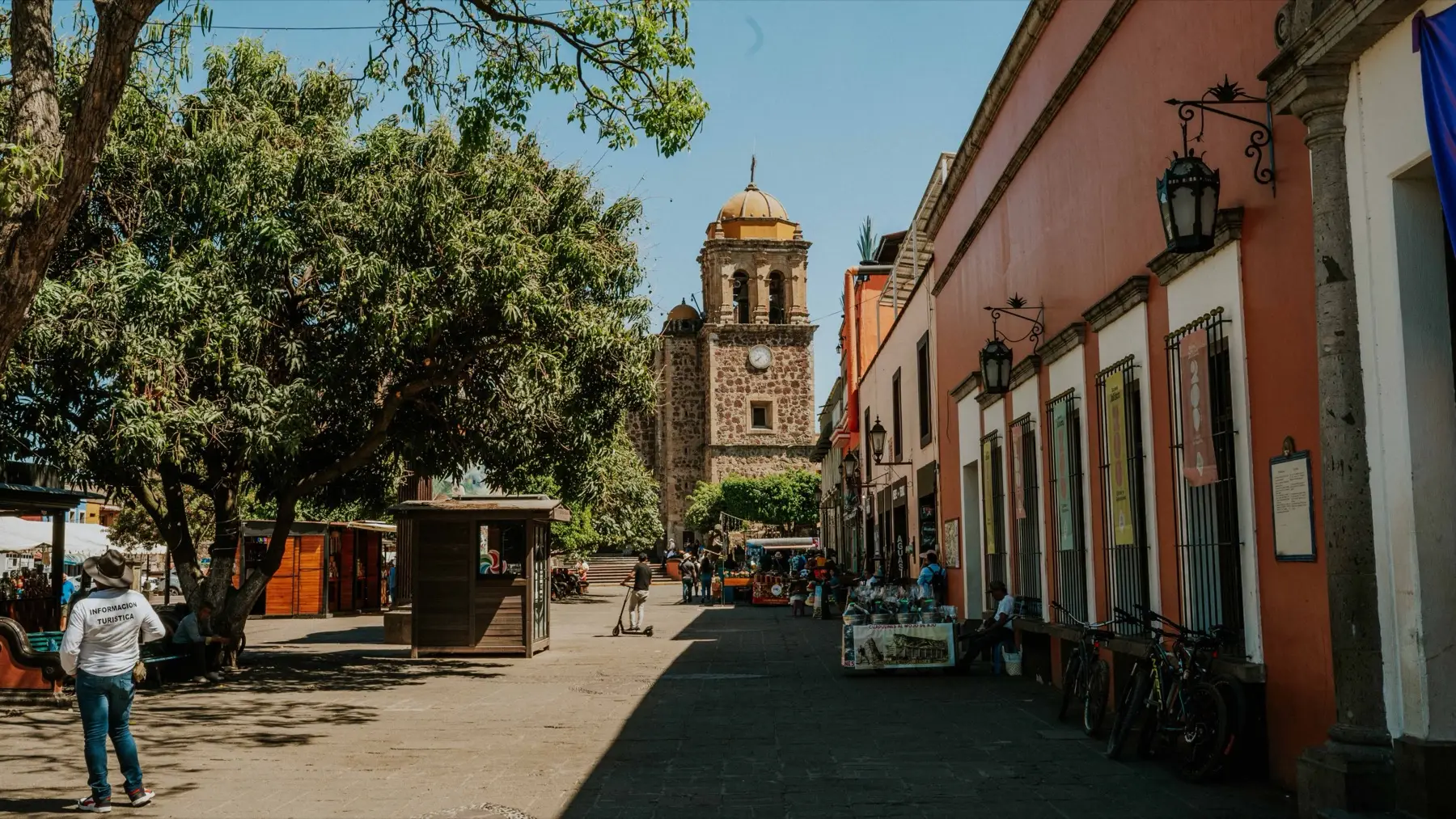 Guadalajara skyline with high-rise residential towers rising above tree-lined avenues and low rooftops