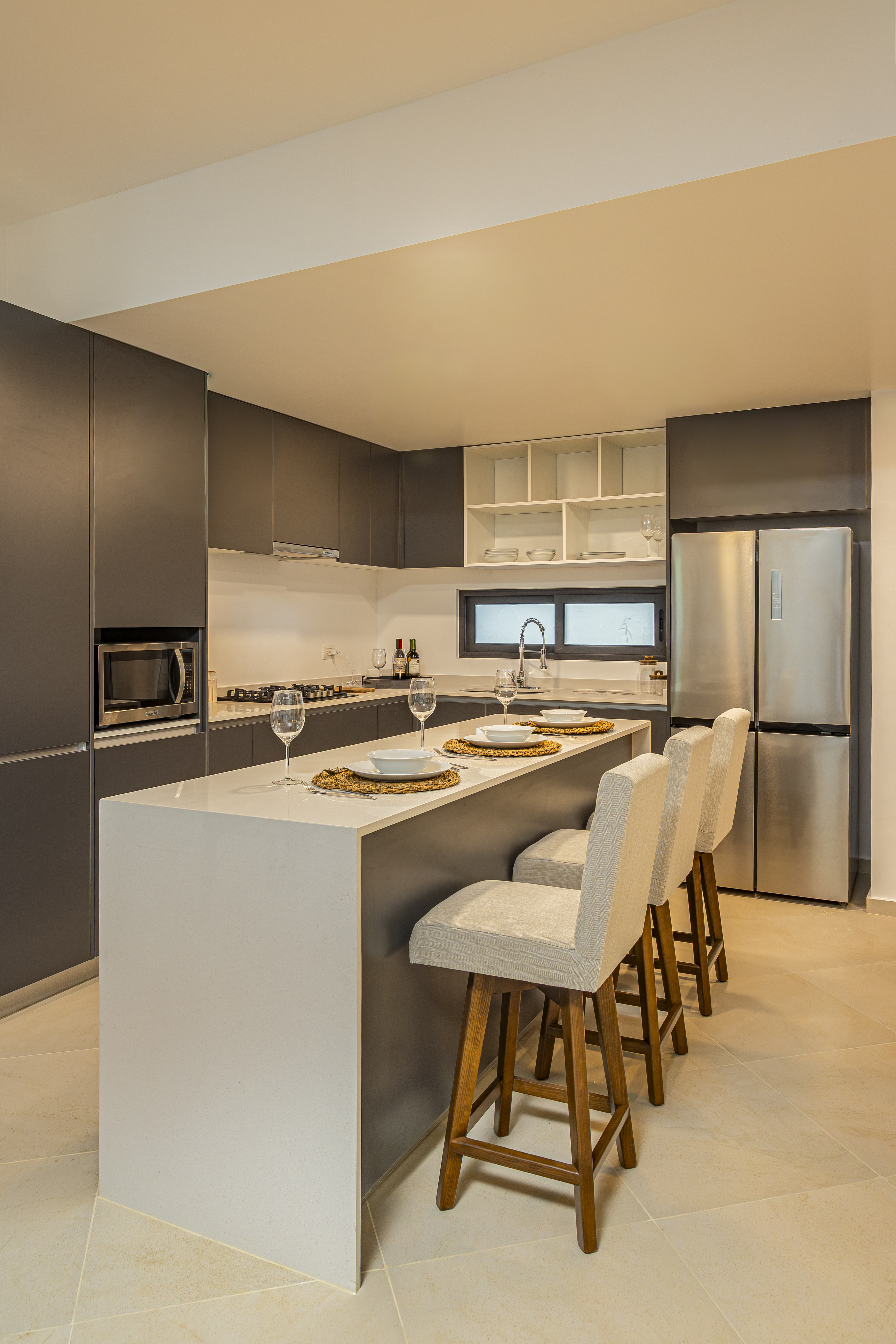 Kitchen with granite counter and integrated cabinetry at Bosques Roble