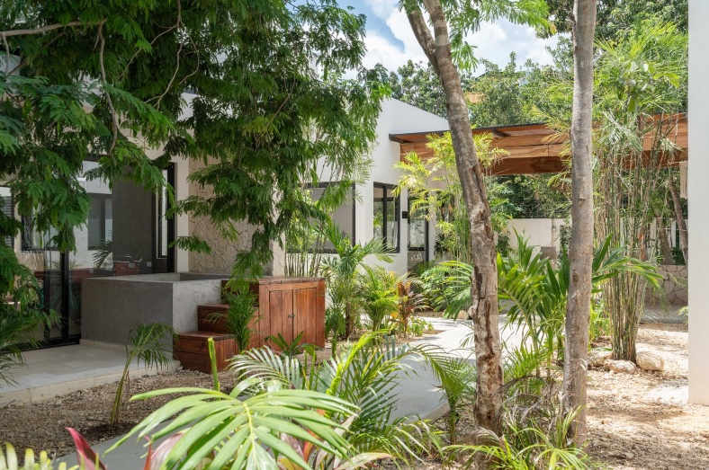 Ground-floor exterior and private terrace area of unit 109 at Erena Mindful Apartments