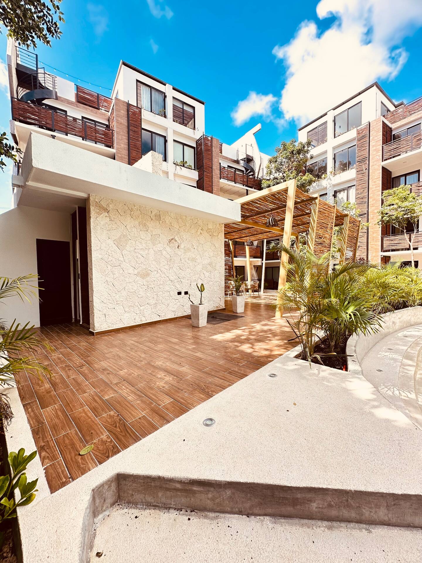 Ground-level entrance and courtyard of Naia Naay Village, Región 15, Tulum