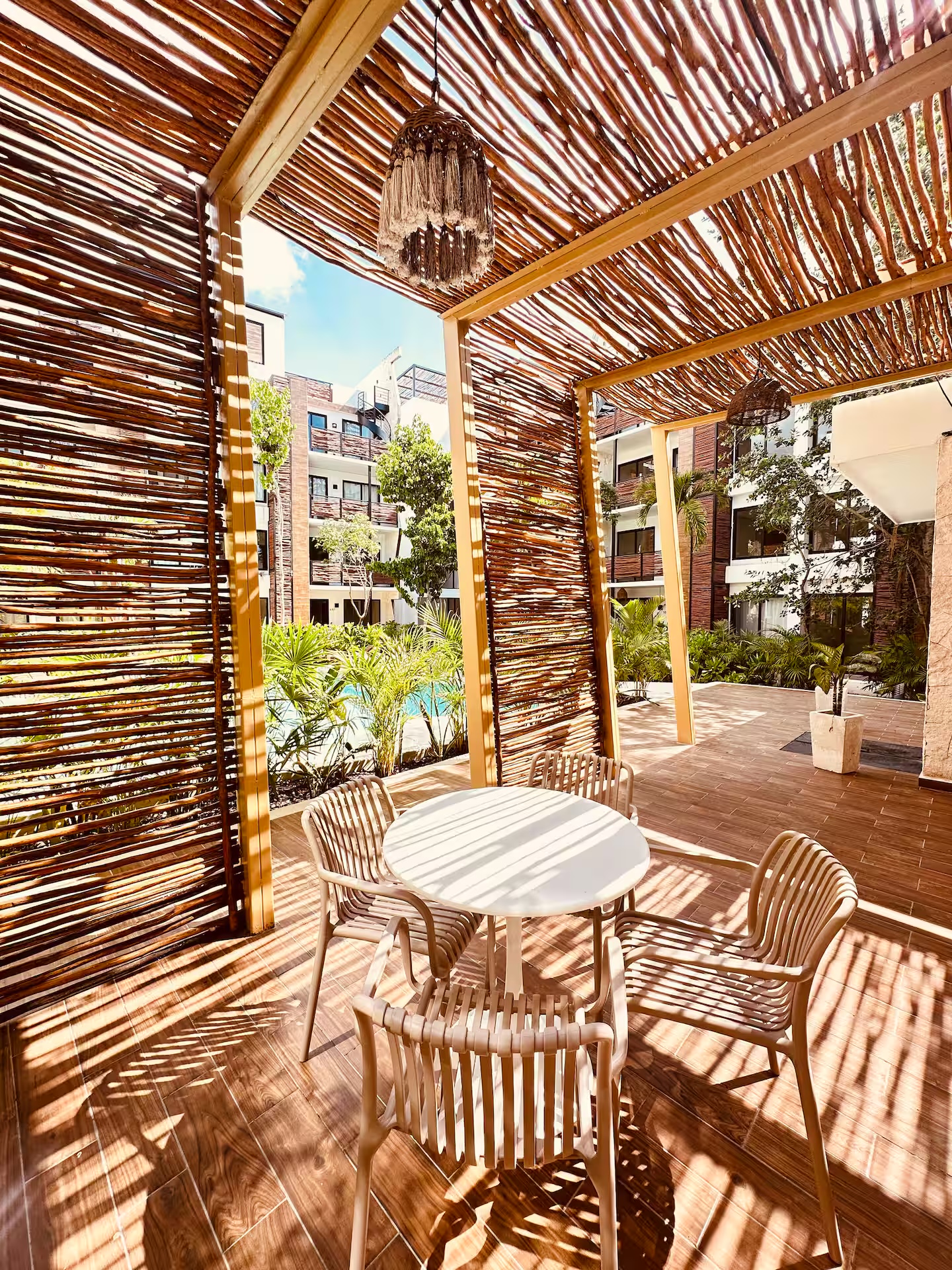 Palapa-roofed lounge seating area at Naia Naay Village