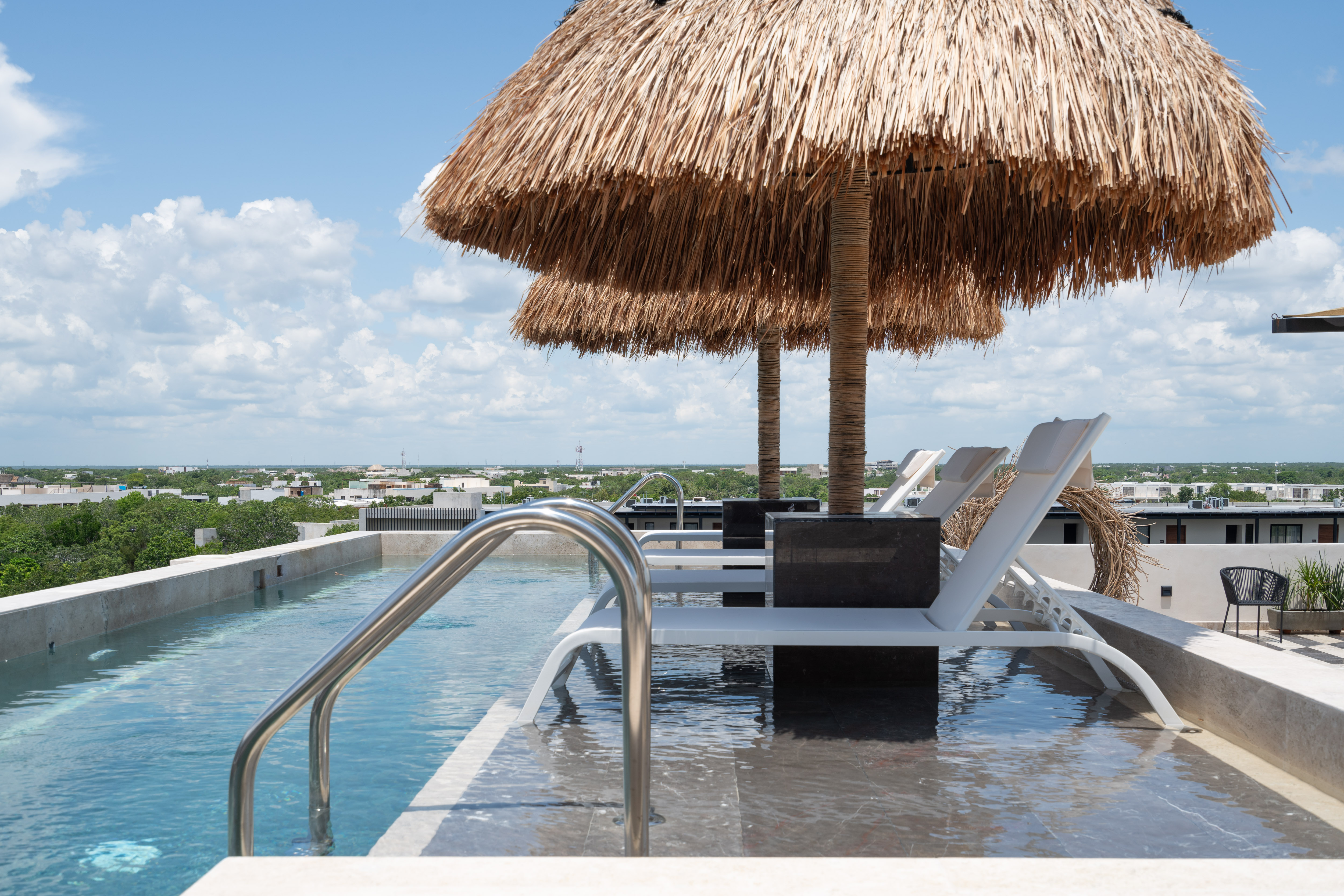 Rooftop pool detail with palapa at Narai