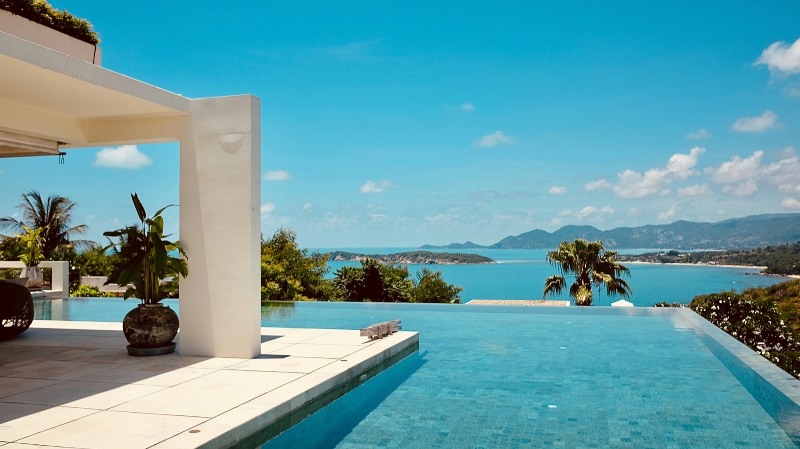 Infinity pool amenity overlooking a bay